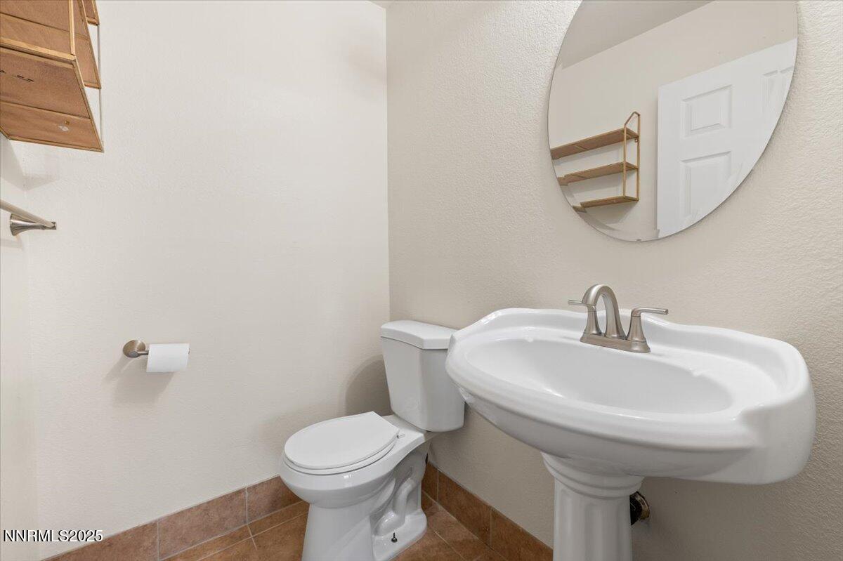 7753 Tulear Street Reno, NV 89506 - Photo 15 of 38 a bathroom with a sink and a toilet