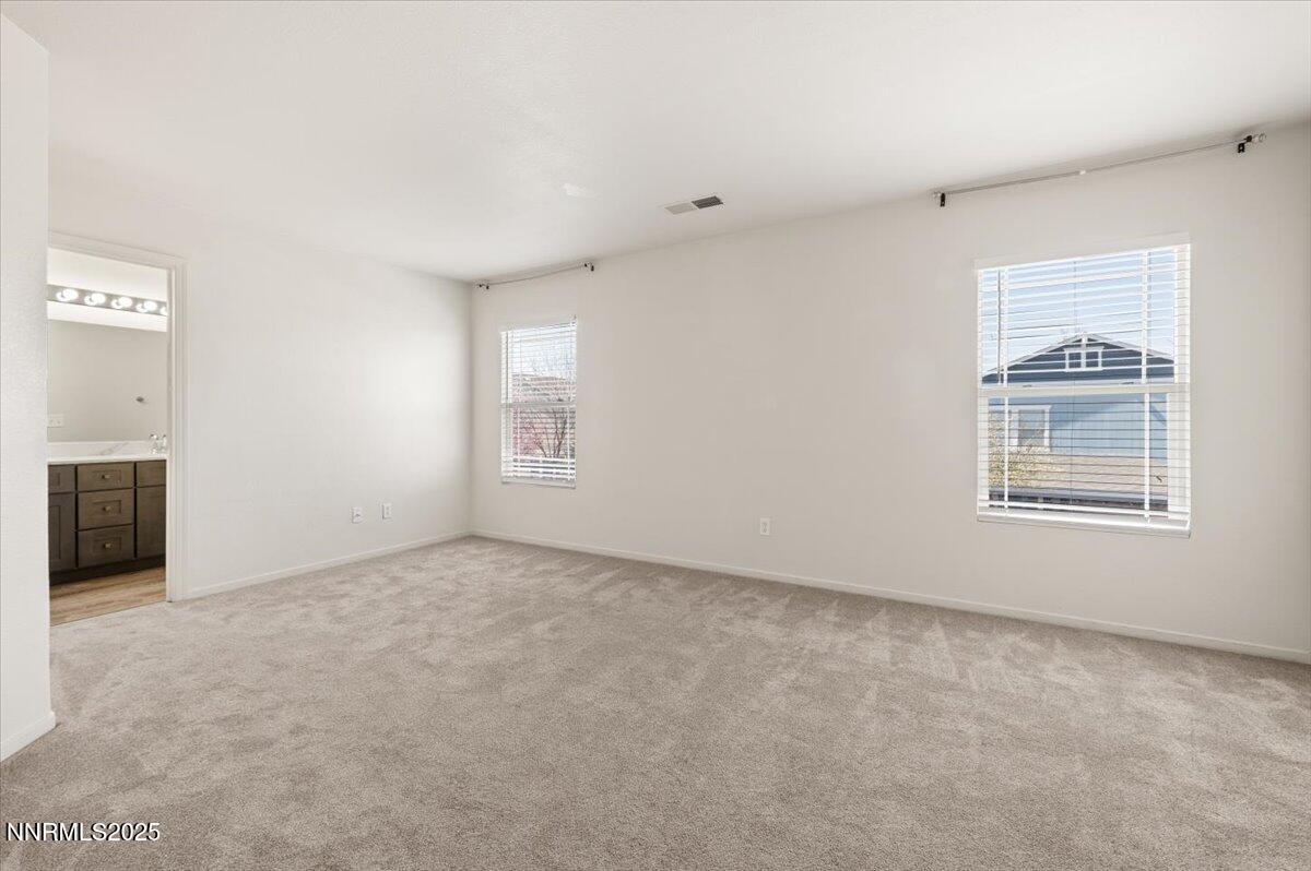 7753 Tulear Street Reno, NV 89506 - Photo 21 of 38 an empty room with windows