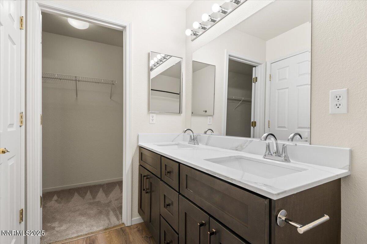 7753 Tulear Street Reno, NV 89506 - Photo 24 of 38 a bathroom with a sink and a mirror