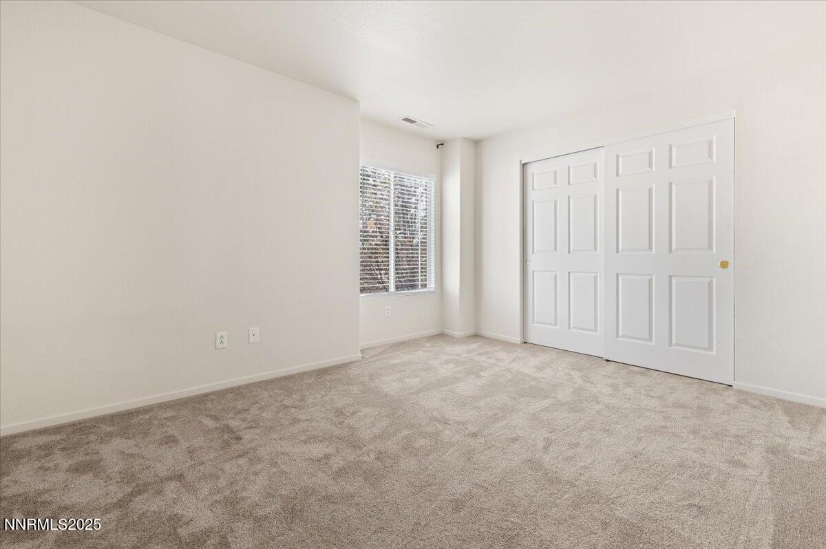 7753 Tulear Street Reno, NV 89506 - Photo 26 of 38 an empty room with windows