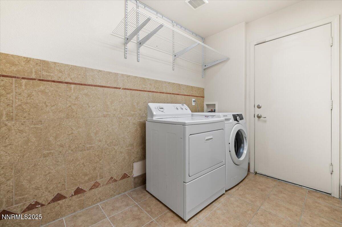 7753 Tulear Street Reno, NV 89506 - Photo 33 of 38 a utility room with dryer and washer