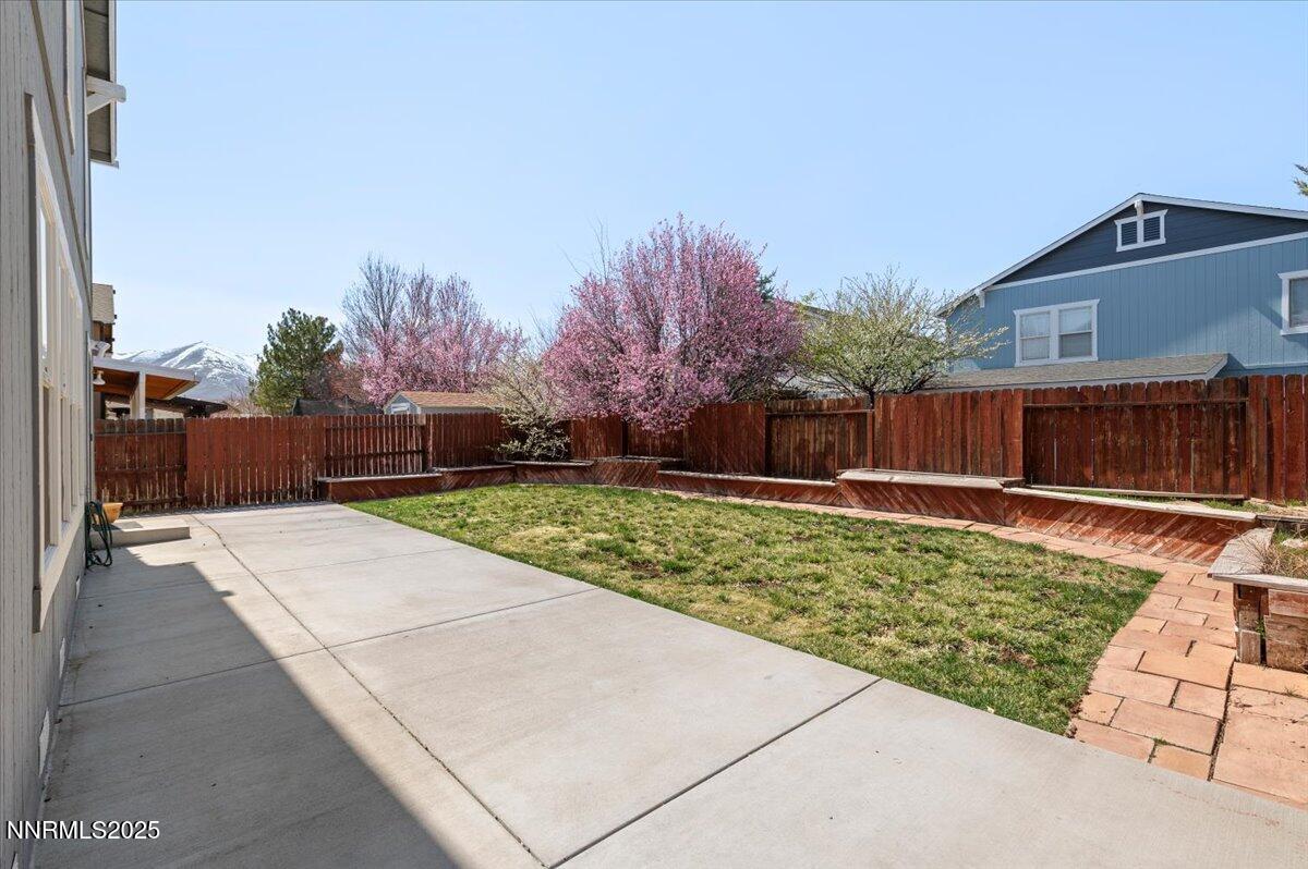 7753 Tulear Street Reno, NV 89506 - Photo 35 of 38 a view of a backyard with a garden