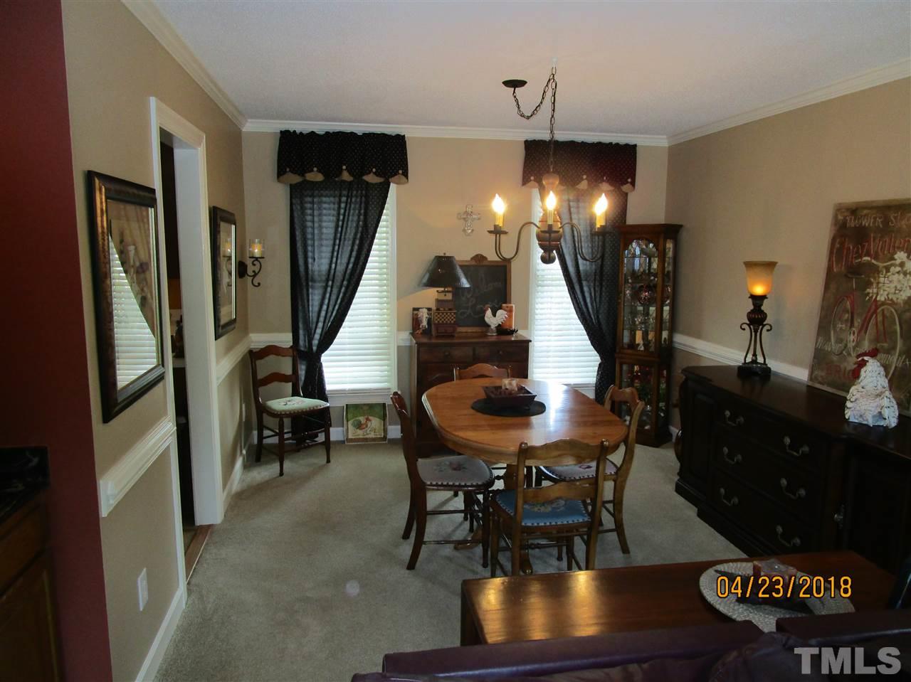 5629 Raddington Street Raleigh, NC 27613 - Photo 8 of 23 a view of a livingroom with furniture and a livingroom