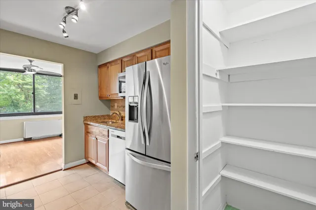 a kitchen with a refrigerator and a refrigerator