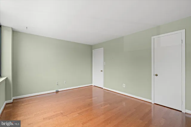 an empty room with wooden floor