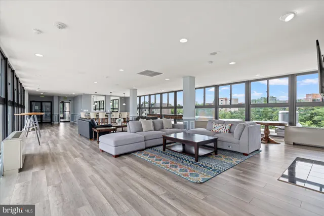 a living room with furniture and a large window