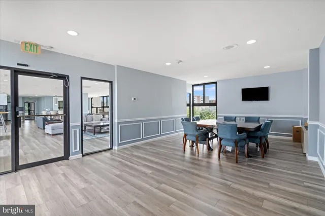 a view of a dining room with furniture and wooden floor