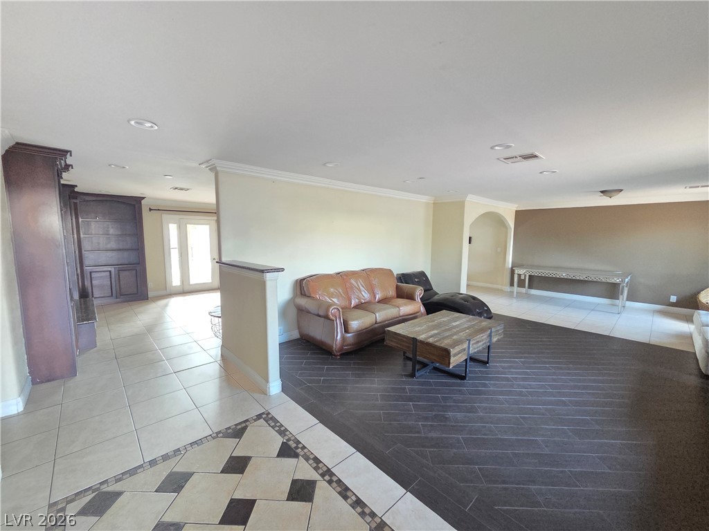 3381 Westwind Road Las Vegas, NV 89146 - Photo 14 of 52 Artfully segmented flooring designs delineate distinct zones within this welcoming living space.