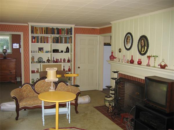 274 Bailey Road Holden, MA 01520 - Photo 3 of 9 a dining room with furniture and a fireplace
