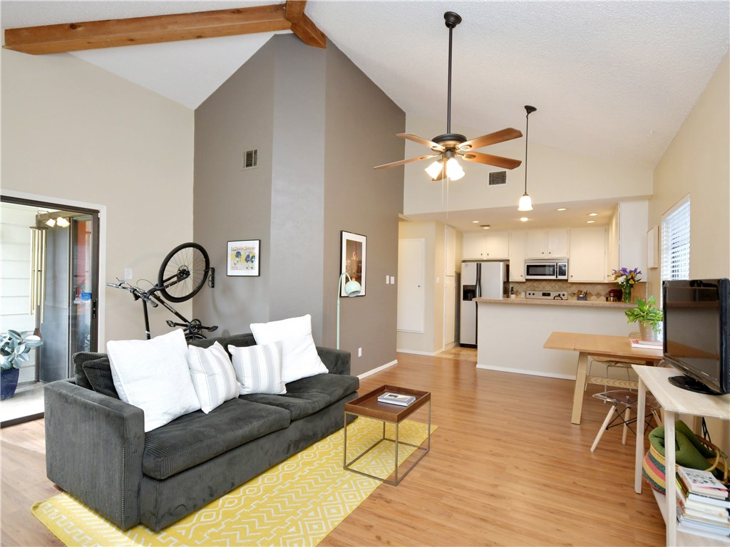 1748 Ohlen Road, Unit 8 Austin, TX 78757 - Photo 1 of 1 a living room with furniture a couch and kitchen view