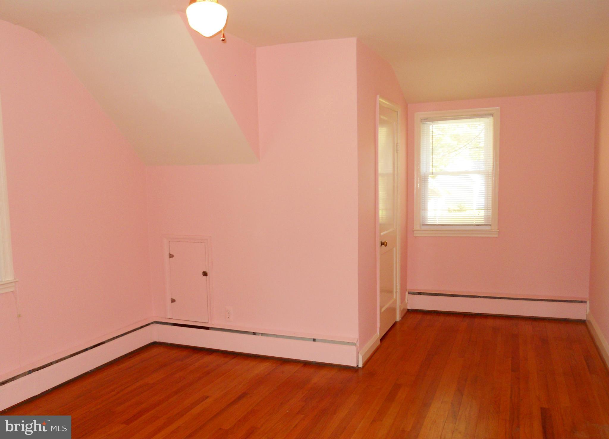 7311 Knollwood Road Baltimore, MD 21286 - Photo 17 of 30 a view of a room with wooden floor and white walls