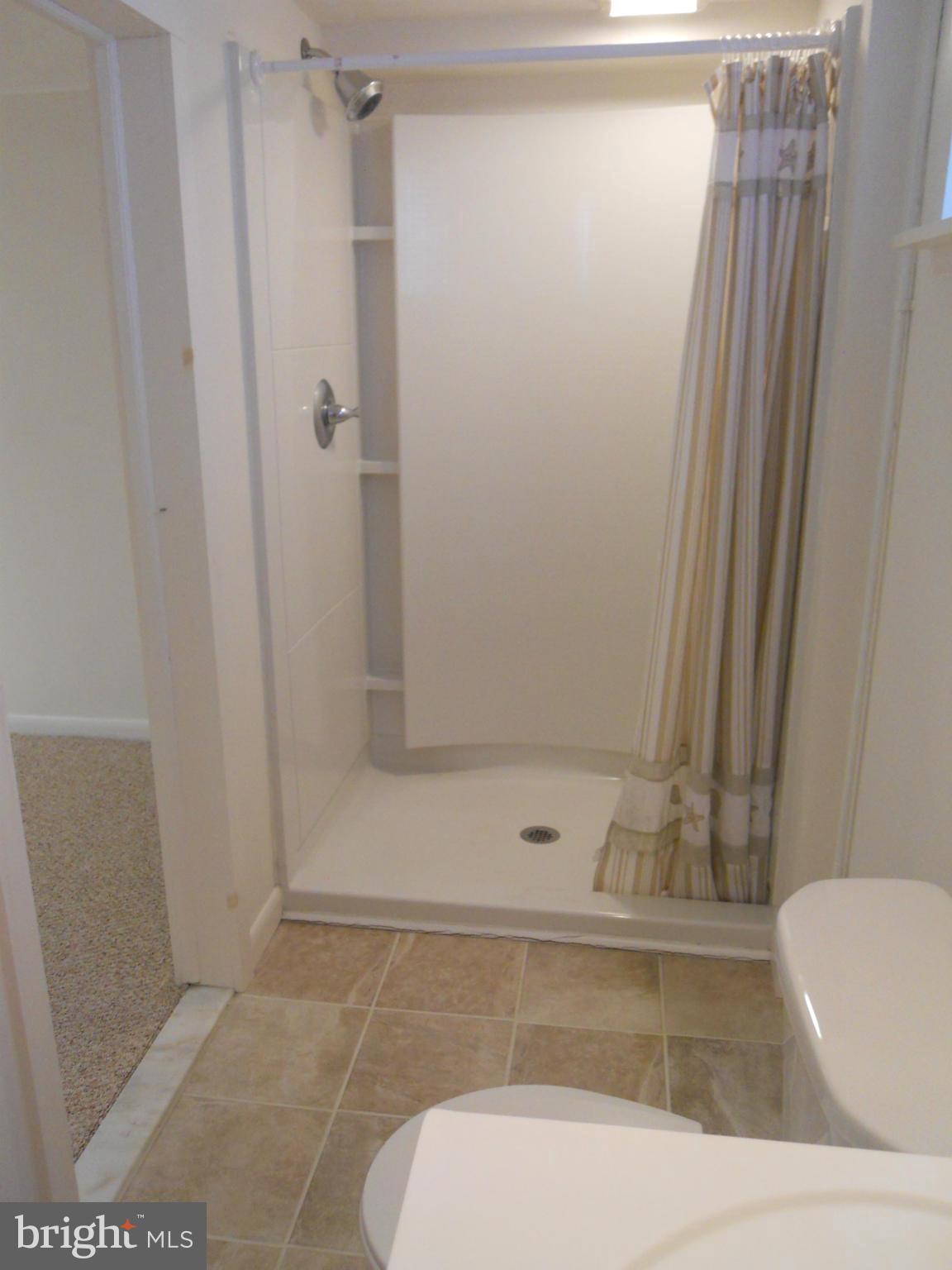 7311 Knollwood Road Baltimore, MD 21286 - Photo 24 of 30 a bathroom with a bathtub