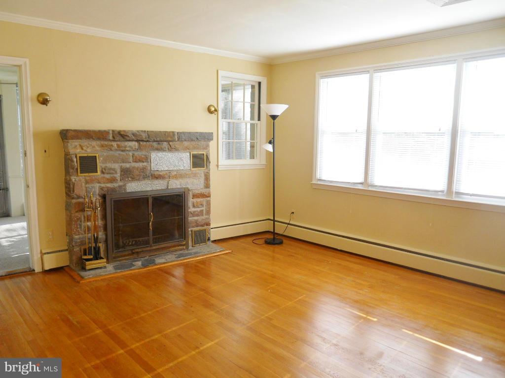 7311 Knollwood Road Baltimore, MD 21286 - Photo 4 of 30 a view of an empty room with a fireplace