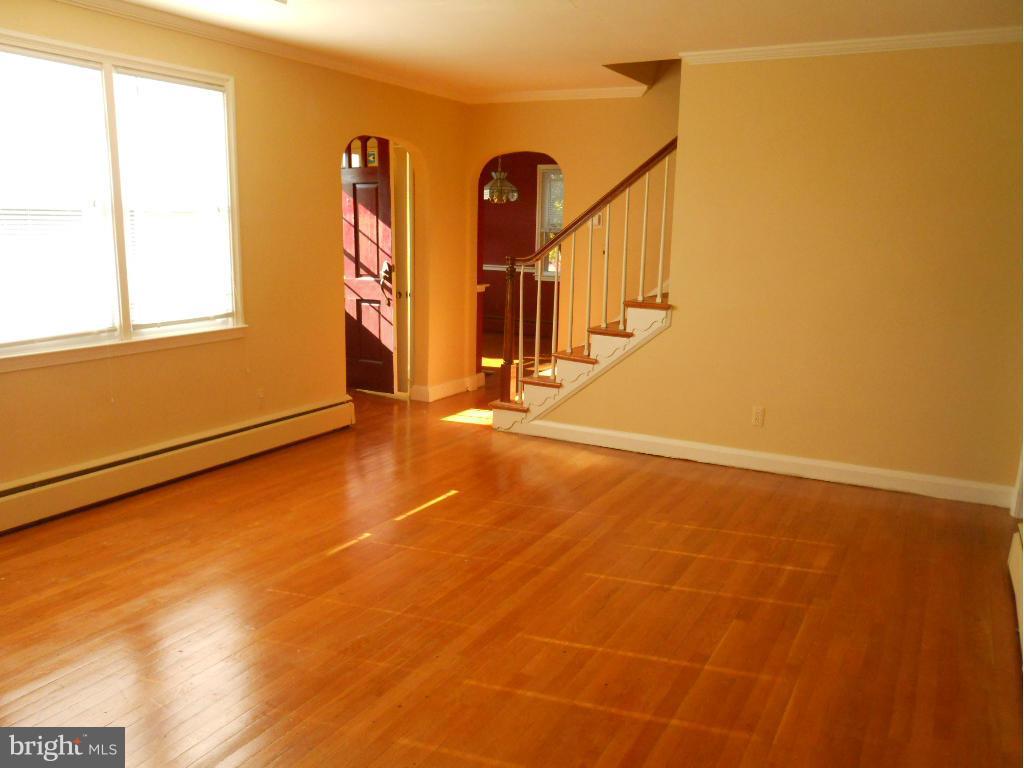 7311 Knollwood Road Baltimore, MD 21286 - Photo 5 of 30 a view of a room with wooden floor and windows