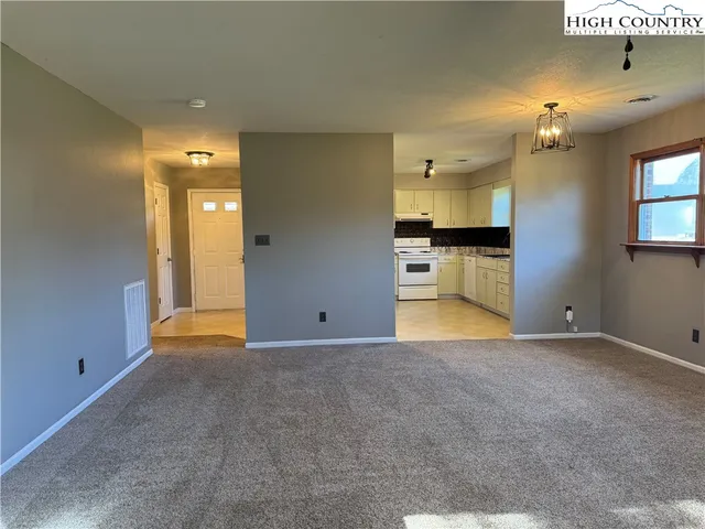 a view of a kitchen and a window