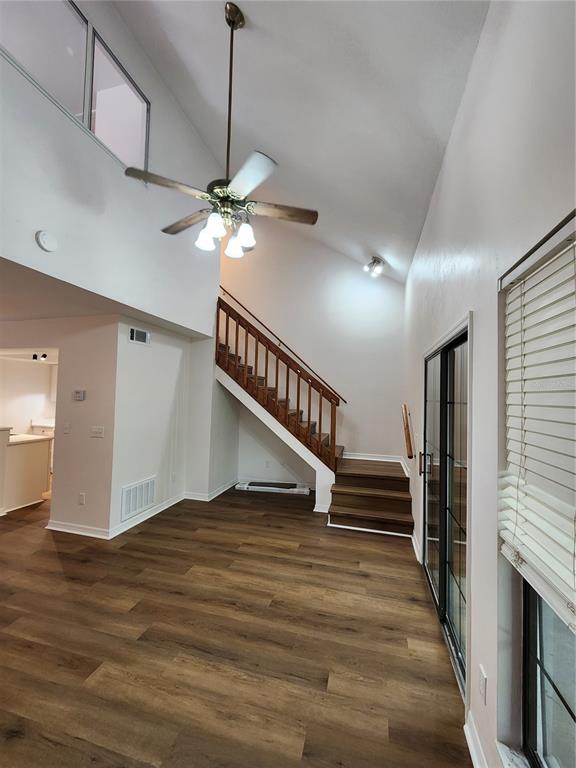 5823 Southwest 9th Place, Unit H55 Gainesville, FL 32607 - Photo 27 of 50 a view of entryway and hall with wooden floor