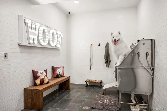 a bedroom with furniture and a wooden floor