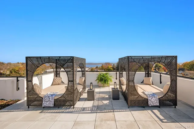 a view of a chairs and table in patio