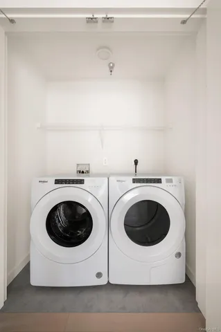 a utility room with dryer and washer