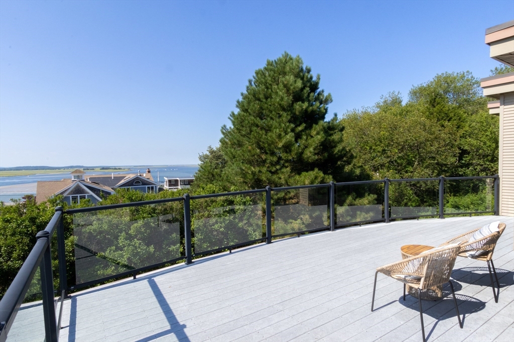 8 Goldfinch Way Ipswich, MA 01938 - Photo 12 of 41 a view of a terrace with couches and wooden fence