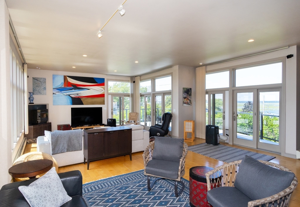 8 Goldfinch Way Ipswich, MA 01938 - Photo 15 of 41 a living room with furniture fireplace and a large window