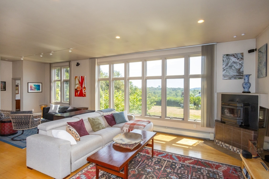 8 Goldfinch Way Ipswich, MA 01938 - Photo 17 of 41 a living room with furniture and a fireplace