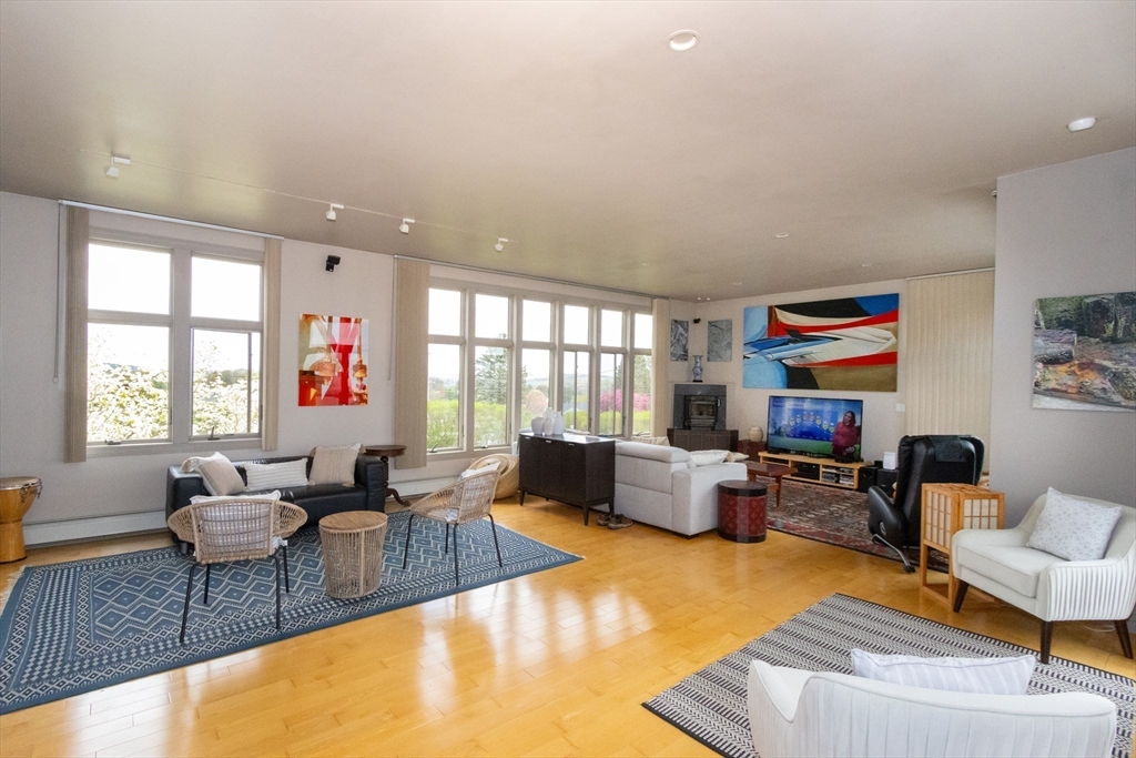 8 Goldfinch Way Ipswich, MA 01938 - Photo 20 of 41 a living room with fireplace furniture and a large window