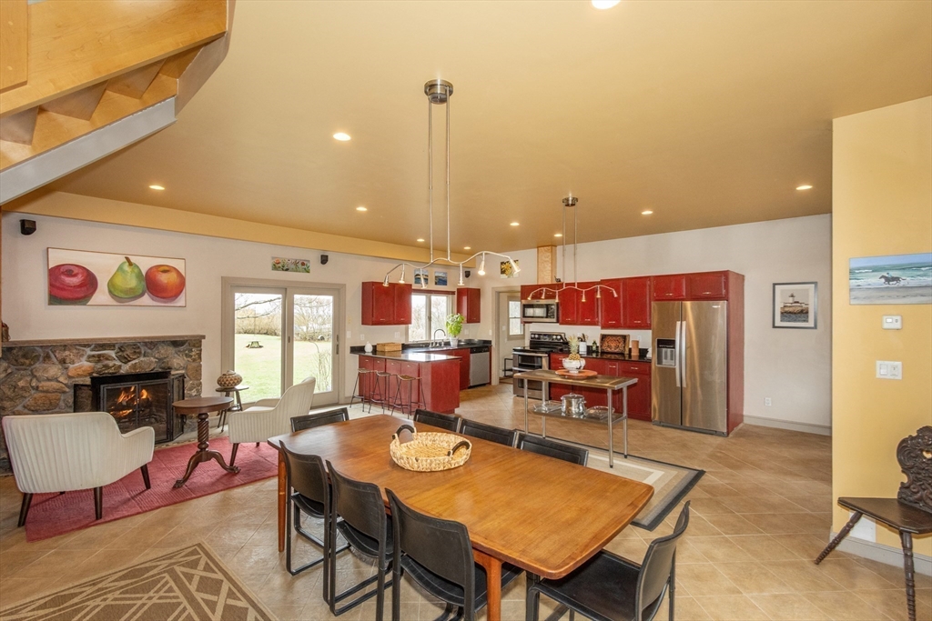 8 Goldfinch Way Ipswich, MA 01938 - Photo 28 of 41 a living room with furniture a rug and a fireplace