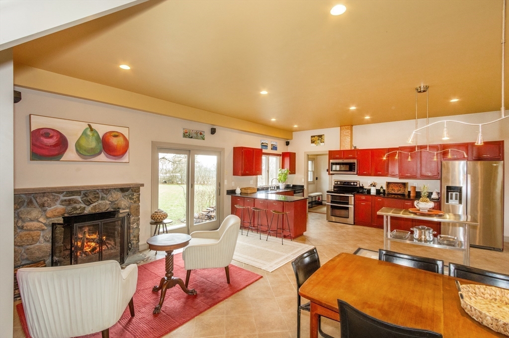 8 Goldfinch Way Ipswich, MA 01938 - Photo 29 of 41 a living room with furniture and a fireplace