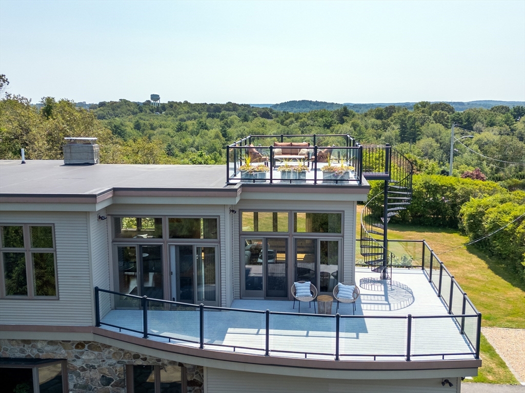 8 Goldfinch Way Ipswich, MA 01938 - Photo 4 of 41 a view of a house with floor to ceiling windows and wooden floor