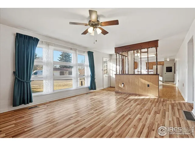 a kitchen with stainless steel appliances granite countertop a sink a stove counter space and cabinets