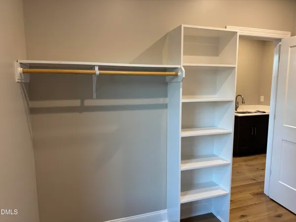 a view of an empty walk in closet