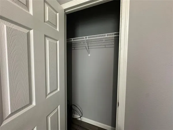 a view of storage and utility room with racks on the wall