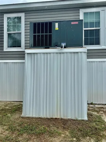 a view of a swimming pool with a yard