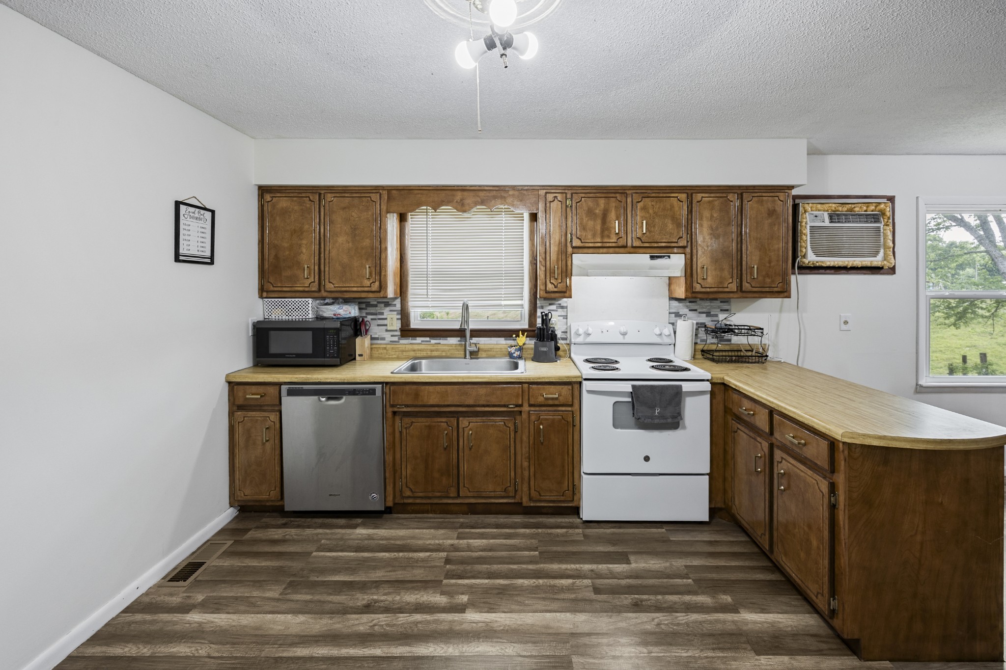 421 Shady Grove Road Flintville, TN 37335 - Photo 21 of 33 a kitchen with a stove and a sink