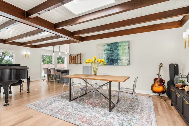 a bedroom with a bed and a table