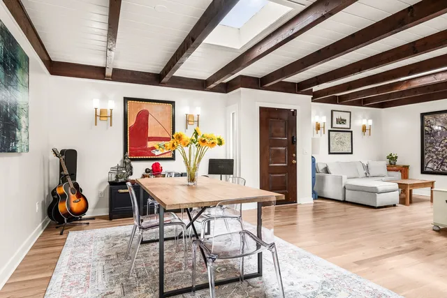 a large kitchen with stainless steel appliances granite countertop a stove a sink dishwasher and a refrigerator