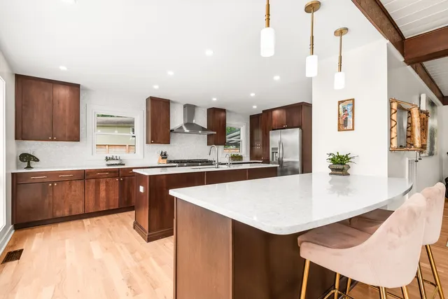 a kitchen with a sink stove and cabinets