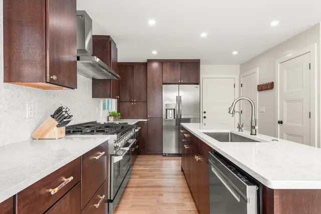 a view of a kitchen with a sink and a window