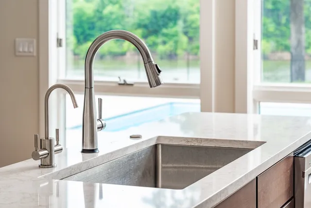 a spacious bathroom with a tub sink and mirror