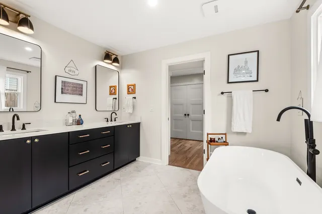 a room with furniture a flat screen tv and a book shelf
