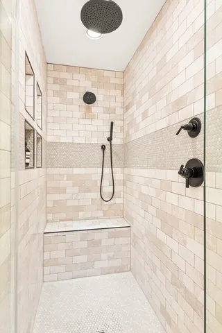 a bathroom with a shower and a bathtub