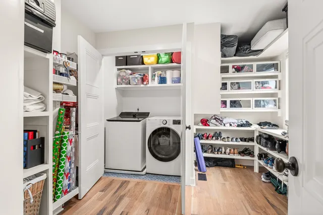 a view of a chair and tables in patio of back yard of the house