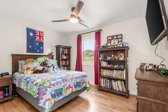 a view of yard with swimming pool and green space