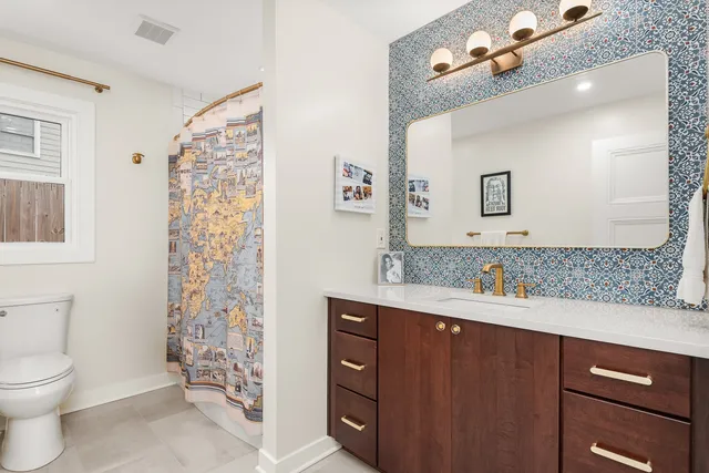 a front view of house with yard and trees