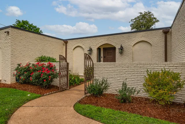 a view of a house with a garden