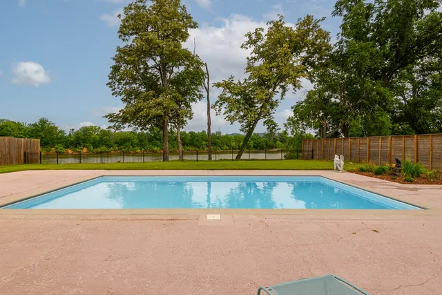 an aerial view of a house with garden space and street view