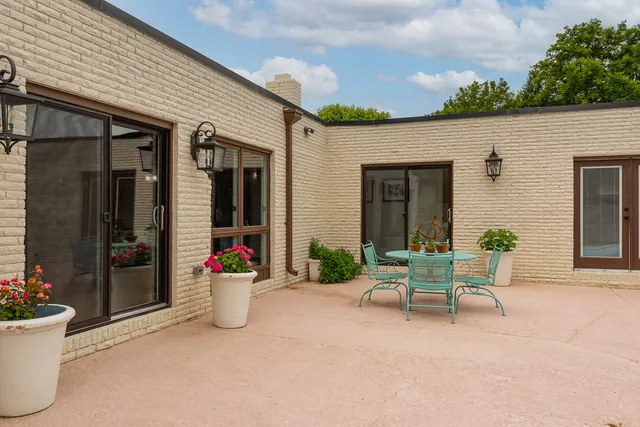 a view of a lake with couches and city view