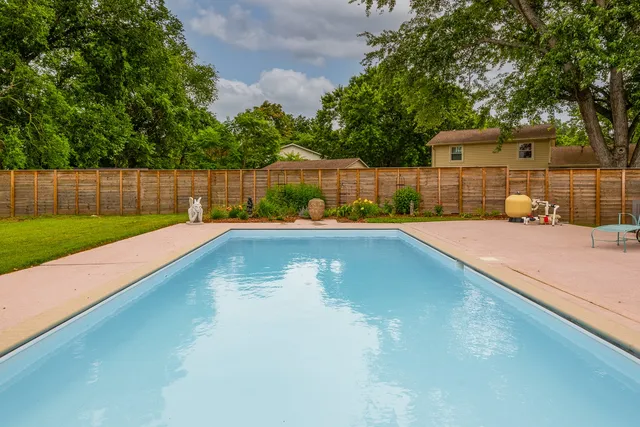 a view of an house with backyard space and garden