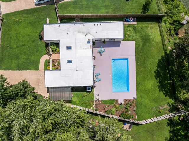 a view of a lake with houses in the back